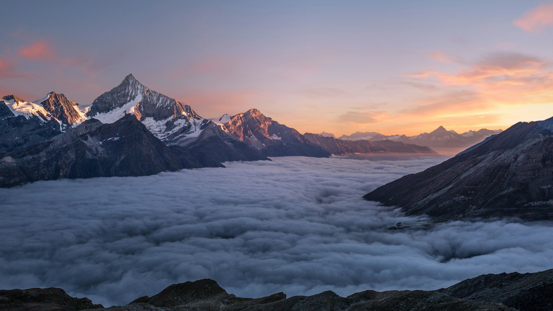 Swiss Alps mountain ridges at golden hour